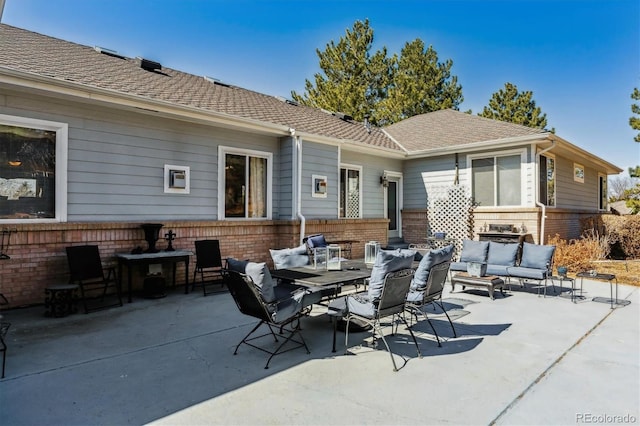 view of patio / terrace with outdoor dining space and an outdoor hangout area