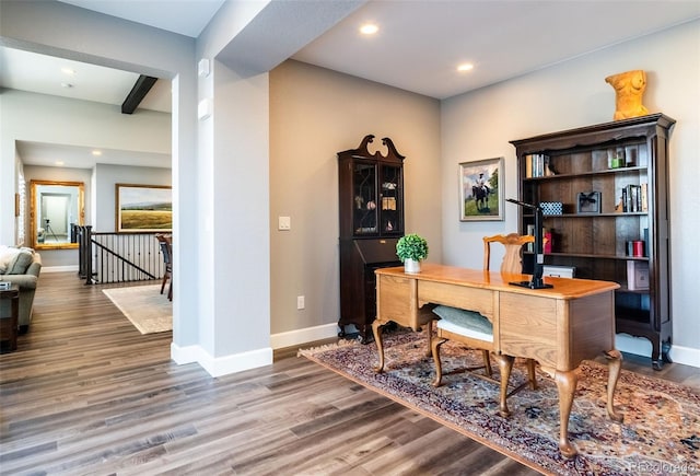 office space with beam ceiling, baseboards, wood finished floors, and recessed lighting