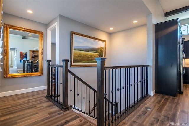 corridor with dark hardwood / wood-style flooring