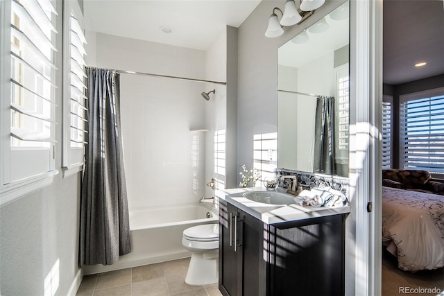 full bathroom featuring shower / bath combo with shower curtain, tile patterned floors, and a wealth of natural light