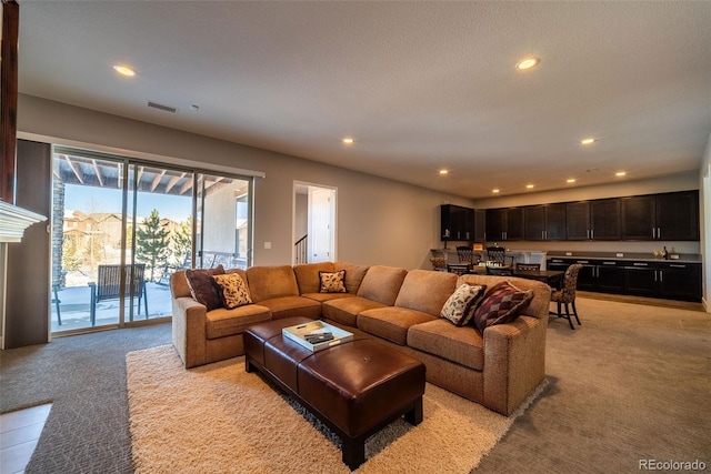 living room featuring light colored carpet