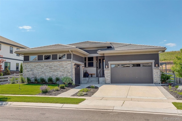 3436 W 154th Ave, Broomfield, CO 80023 - prairie-style house featuring stone siding, concrete driveway, and a garage