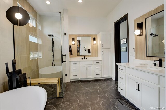 3436 W 154th Ave, Broomfield, CO 80023 - full bath with a stall shower, marble tiled flooring, two vanities, recessed lighting, and a soaking tub