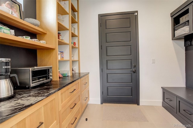3436 W 154th Ave, Broomfield, CO 80023 - kitchen with light brown cabinets, dark stone counters, and open shelves