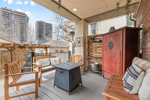 449 S Humboldt St, Denver, CO 80209 - wooden terrace with an outdoor living space and a city view