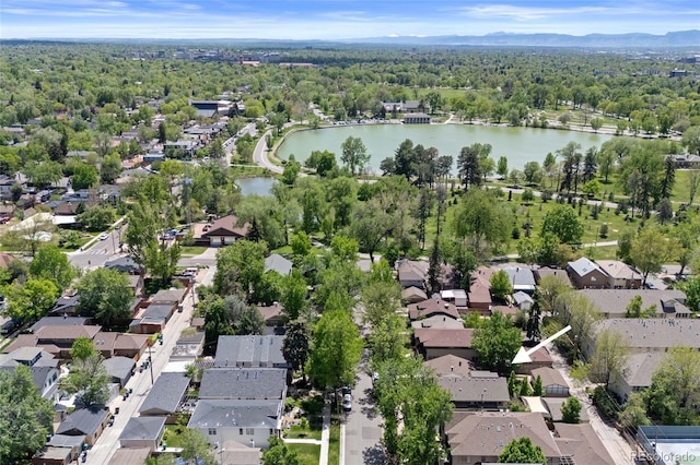 449 S Humboldt St, Denver, CO 80209 - aerial overview of property's location with a water and mountain view, nearby suburban area, and a heavily wooded area