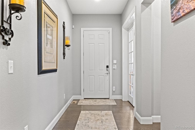 doorway to outside with dark hardwood / wood-style floors