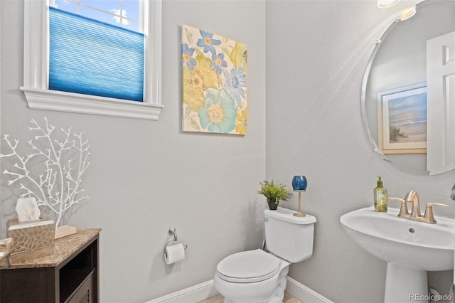 bathroom featuring toilet and sink