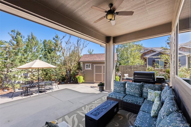 view of patio with a storage shed, an outdoor living space, a grill, and ceiling fan