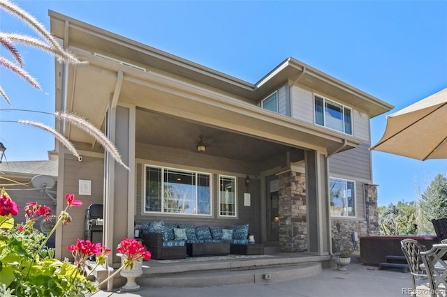 doorway to property with a patio area