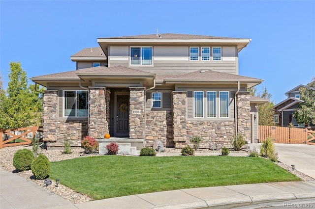 prairie-style home with a front lawn