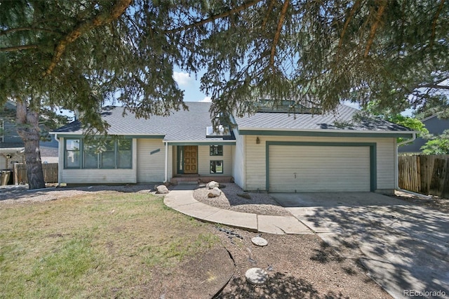 11210 Quivas Loop, Denver, CO 80234 - view of front of property featuring a garage, driveway, and a shingled roof