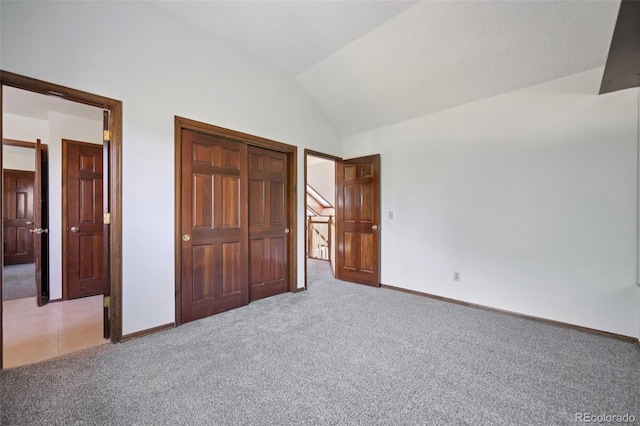 11210 Quivas Loop, Denver, CO 80234 - unfurnished bedroom with light colored carpet, lofted ceiling, and a closet