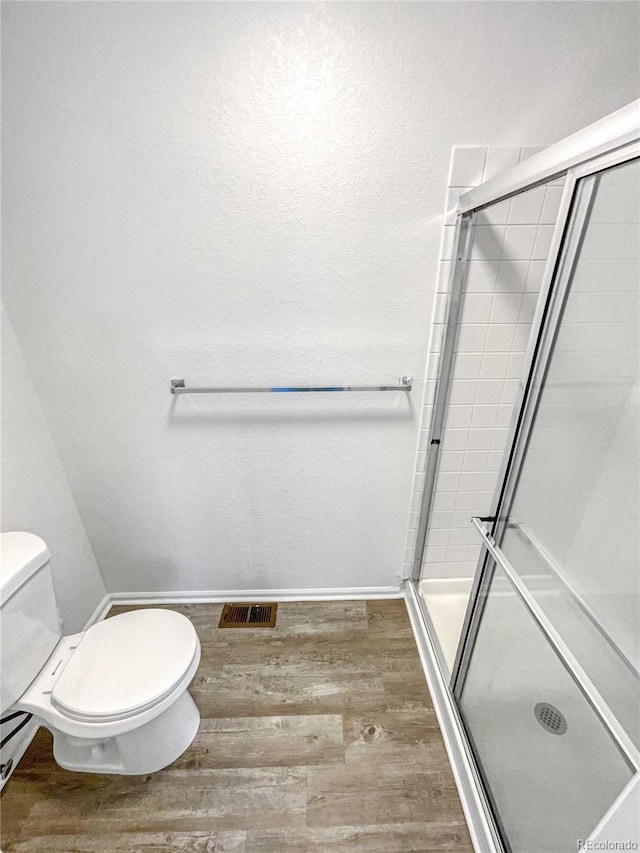 19093 E Linvale Pl, Aurora, CO 80013 - bathroom featuring wood finished floors and a stall shower