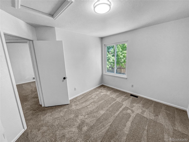 19093 E Linvale Pl, Aurora, CO 80013 - unfurnished bedroom featuring attic access, carpet flooring, and a textured ceiling
