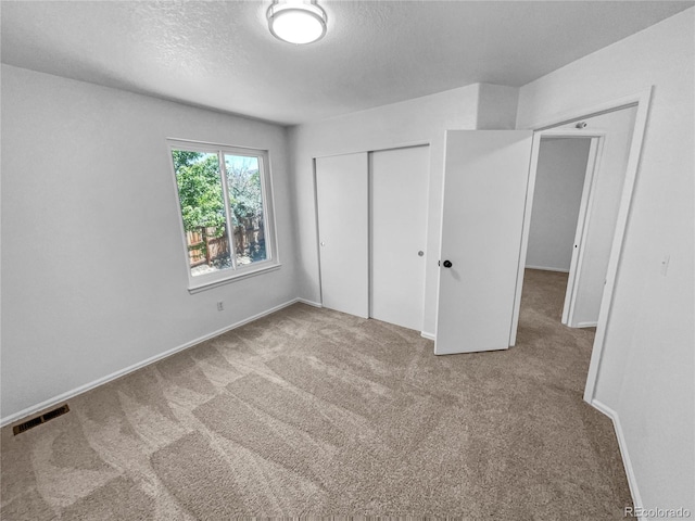 19093 E Linvale Pl, Aurora, CO 80013 - unfurnished bedroom featuring carpet flooring, a closet, and a textured ceiling