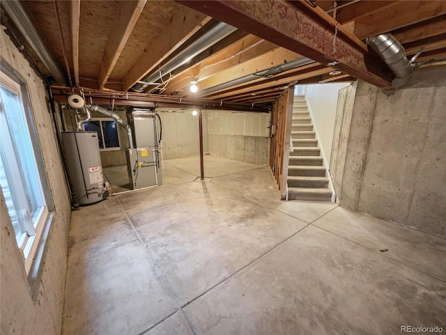 19093 E Linvale Pl, Aurora, CO 80013 - below grade area featuring water heater, stairway, and heating unit