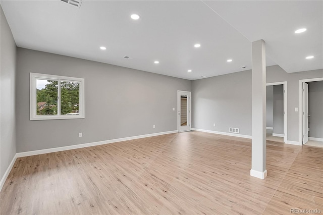 unfurnished room featuring recessed lighting, visible vents, baseboards, and light wood finished floors