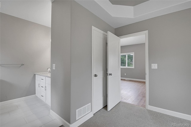 bathroom with visible vents, baseboards, and vanity