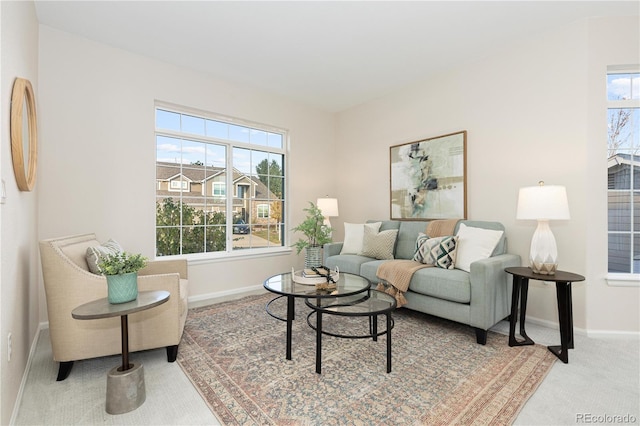 carpeted living room featuring a healthy amount of sunlight