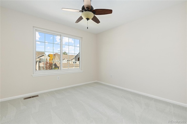 empty room with light carpet and ceiling fan