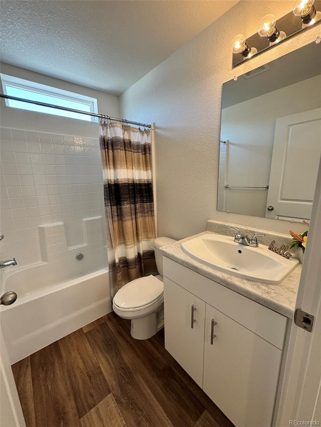 5060 N Walden Way, Denver, CO 80249 - full bathroom featuring wood finished floors, toilet, a textured ceiling, a textured wall, and shower / bath combination with curtain