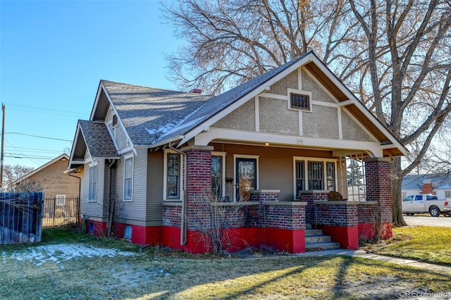 view of front of home featuring a front lawn and a porch