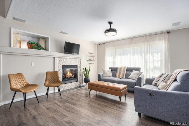 22002 E Irish Dr, Aurora, CO 80016 - living area with dark wood-style floors and a tile fireplace