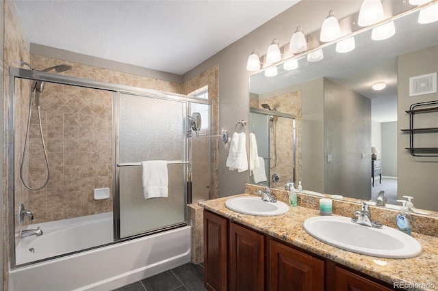 22002 E Irish Dr, Aurora, CO 80016 - bathroom featuring enclosed tub / shower combo and double vanity