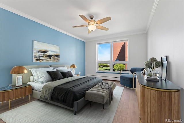 320 S Ames St Unit 5, Lakewood, CO 80226 - bedroom featuring light wood-style floors, crown molding, a baseboard radiator, and a ceiling fan