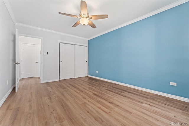 320 S Ames St Unit 5, Lakewood, CO 80226 - unfurnished bedroom with light wood-style flooring, baseboards, a closet, and crown molding
