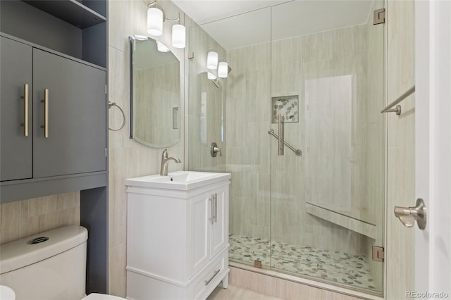 320 S Ames St Unit 5, Lakewood, CO 80226 - bathroom with a stall shower, toilet, and vanity