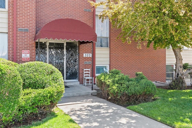 320 S Ames St Unit 5, Lakewood, CO 80226 - property entrance with brick siding
