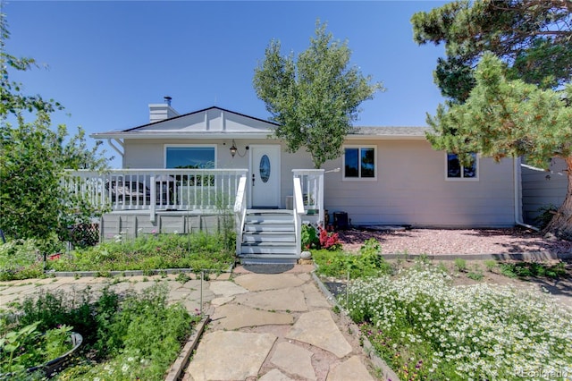 45321 Summit Rd, Parker, CO 80138 - ranch-style house with a chimney and a porch