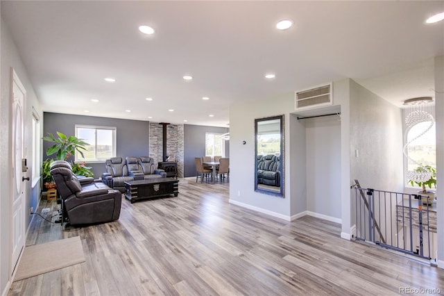 45321 Summit Rd, Parker, CO 80138 - living area with light wood finished floors, a wood stove, and recessed lighting