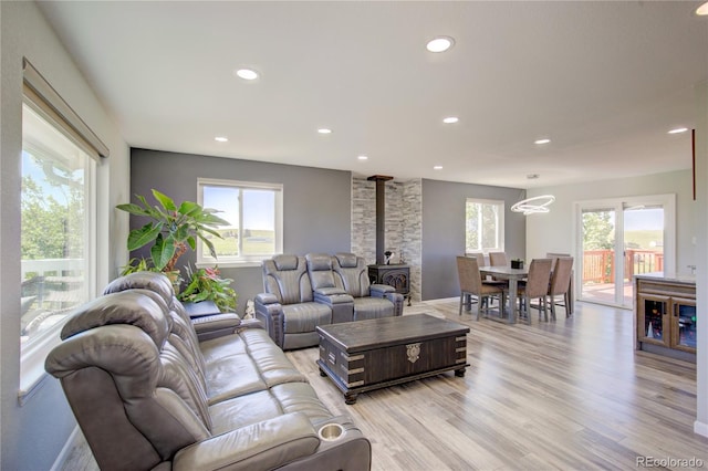 45321 Summit Rd, Parker, CO 80138 - living room with light wood-type flooring, recessed lighting, and a wood stove