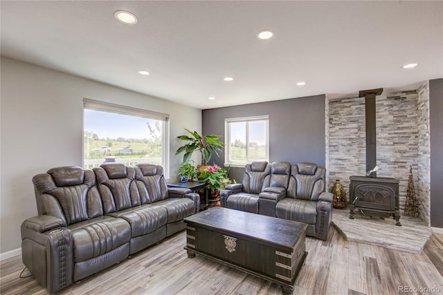 45321 Summit Rd, Parker, CO 80138 - living area with a wood stove, light wood finished floors, and recessed lighting