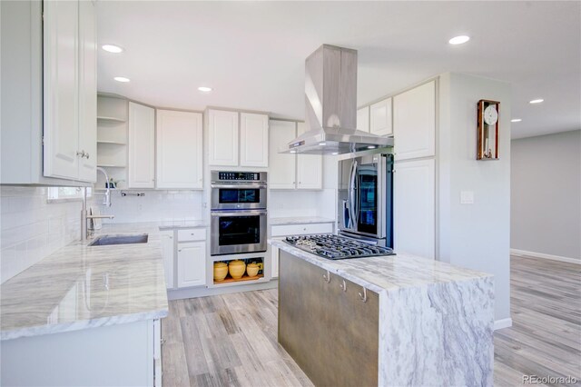 45321 Summit Rd, Parker, CO 80138 - kitchen with open shelves, appliances with stainless steel finishes, island range hood, light stone countertops, and recessed lighting