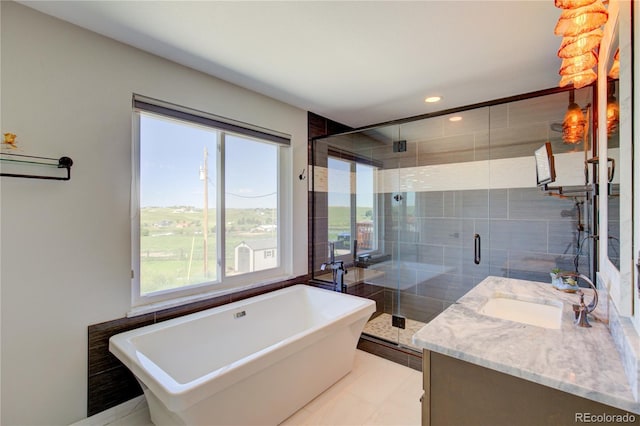 45321 Summit Rd, Parker, CO 80138 - full bathroom with a freestanding bath, plenty of natural light, vanity, a stall shower, and recessed lighting