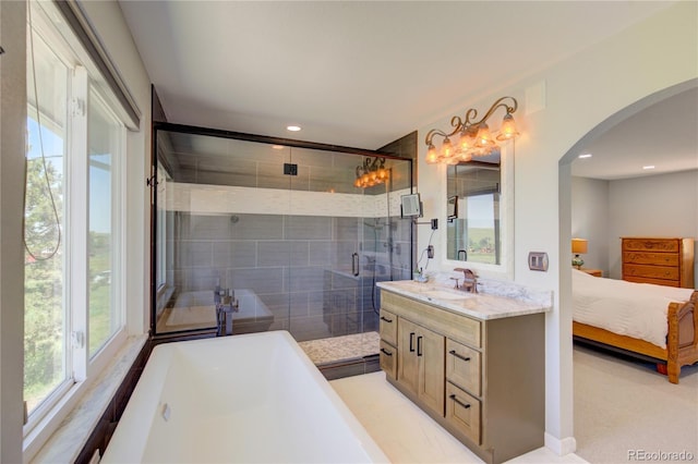 45321 Summit Rd, Parker, CO 80138 - bathroom featuring vanity, a soaking tub, plenty of natural light, ensuite bathroom, and recessed lighting