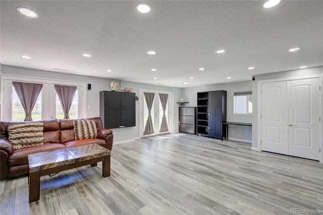 45321 Summit Rd, Parker, CO 80138 - living room with light wood finished floors, recessed lighting, and a textured ceiling