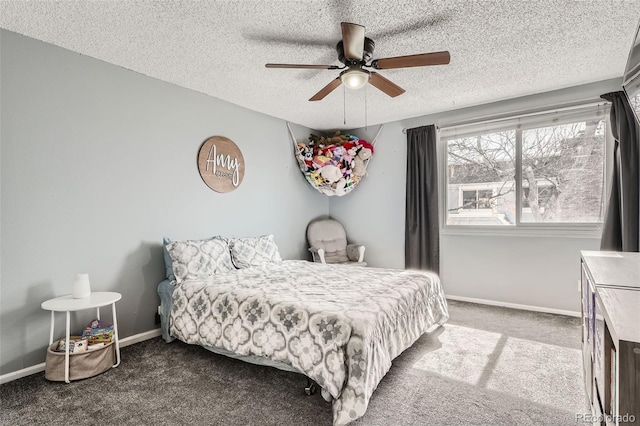 carpeted bedroom with baseboards, a textured ceiling, and ceiling fan