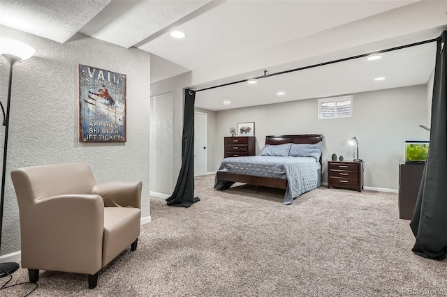 bedroom with recessed lighting, baseboards, carpet, and a textured wall