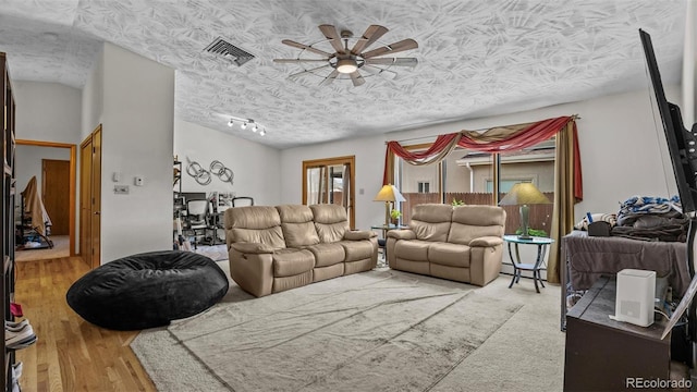 2923 Bonito Ave, Grand Junction, CO 81504 - living area featuring a ceiling fan, a textured ceiling, and wood finished floors