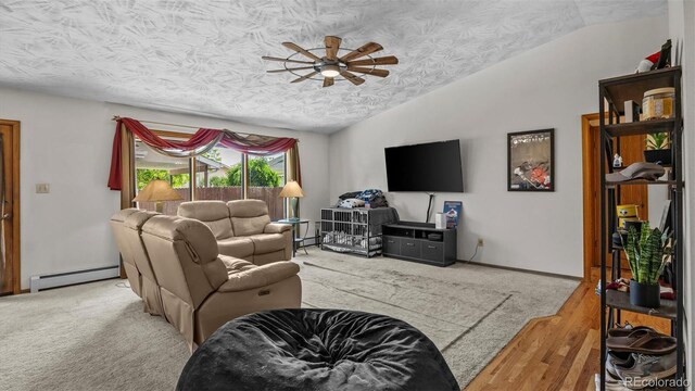 2923 Bonito Ave, Grand Junction, CO 81504 - living room with lofted ceiling, baseboard heating, a textured ceiling, a ceiling fan, and wood finished floors