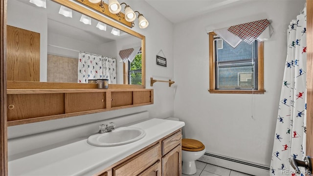 2923 Bonito Ave, Grand Junction, CO 81504 - full bathroom featuring baseboard heating, toilet, vanity, tile patterned flooring, and a shower with shower curtain