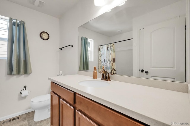 bathroom featuring vanity, toilet, baseboards, a shower with curtain, and visible vents