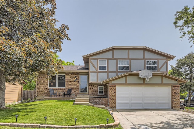 16602 E Gunnison Pl, Aurora, CO 80017 - tudor-style house with a garage, concrete driveway, brick siding, and a shingled roof
