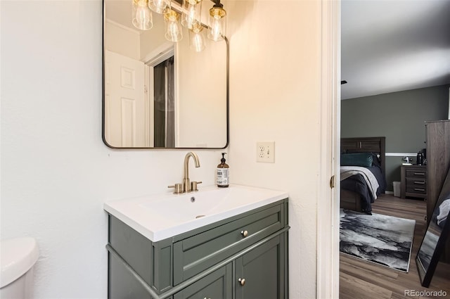 16602 E Gunnison Pl, Aurora, CO 80017 - ensuite bathroom with vanity, wood finished floors, and toilet