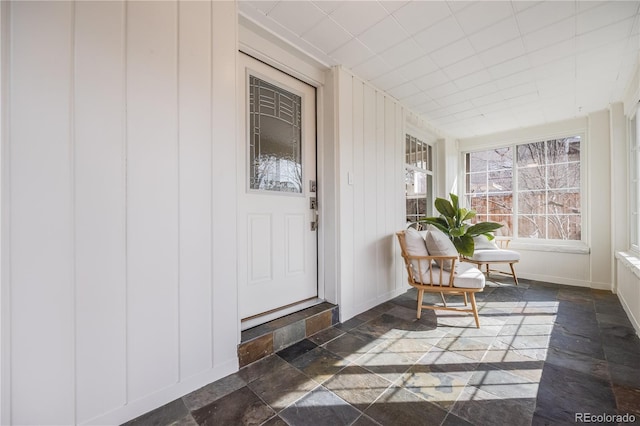 entrance to property featuring a porch